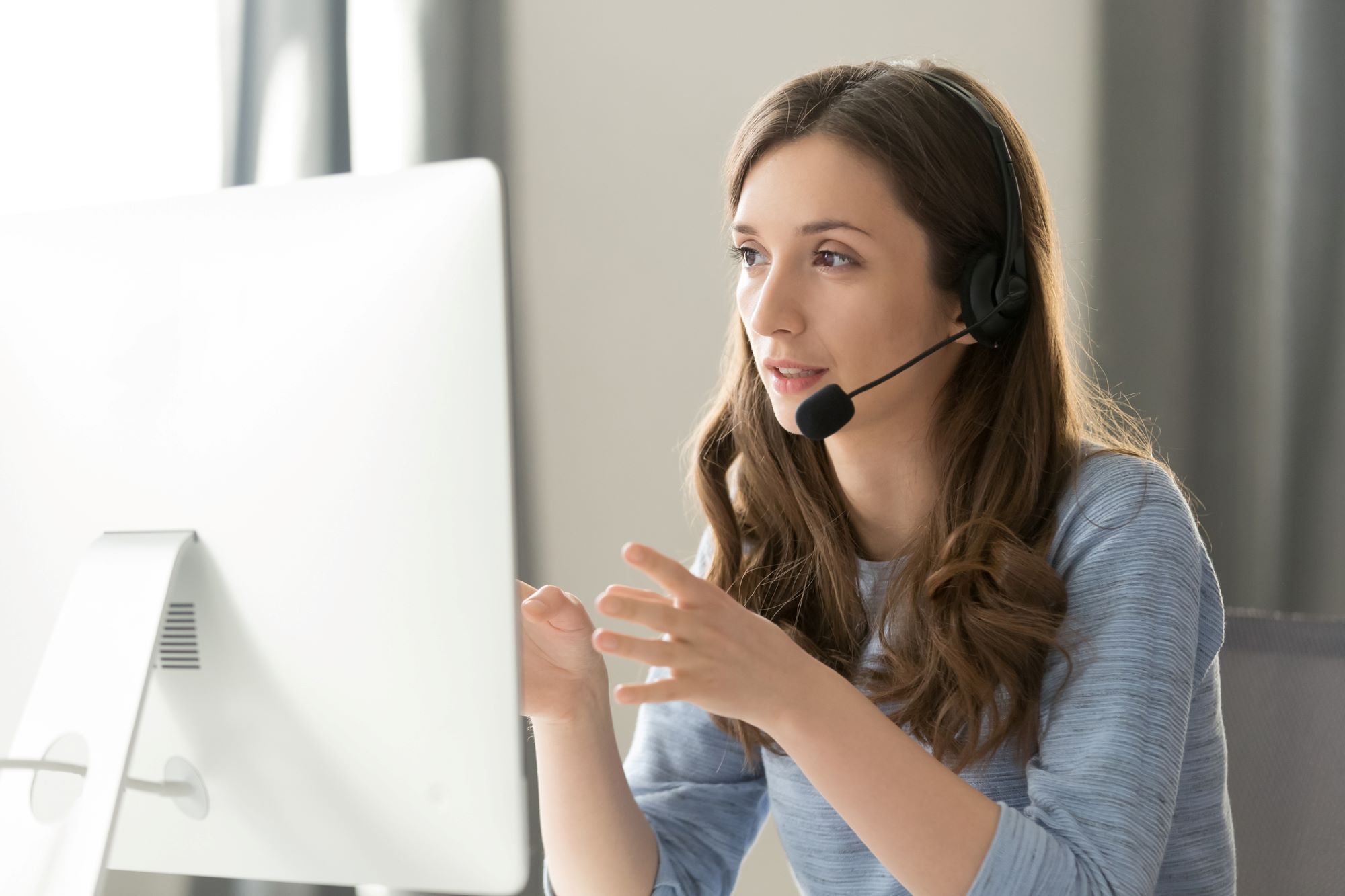 female healthcare strike staffing recruiter looking at computer monitor female healthcare strike staffing recruiter looking at computer monitor