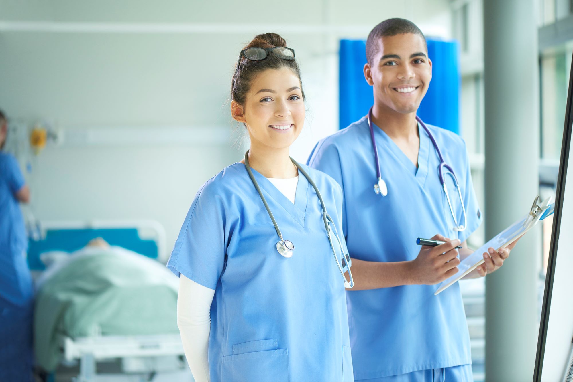 male and female strike therapists in scrubs in hospital male and female strike therapists in scrubs in hospital